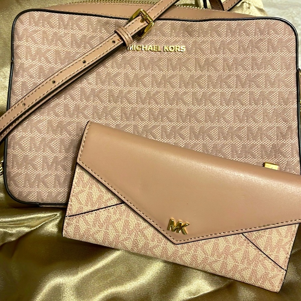 Michael Kors light pink crossbody and wallet set.